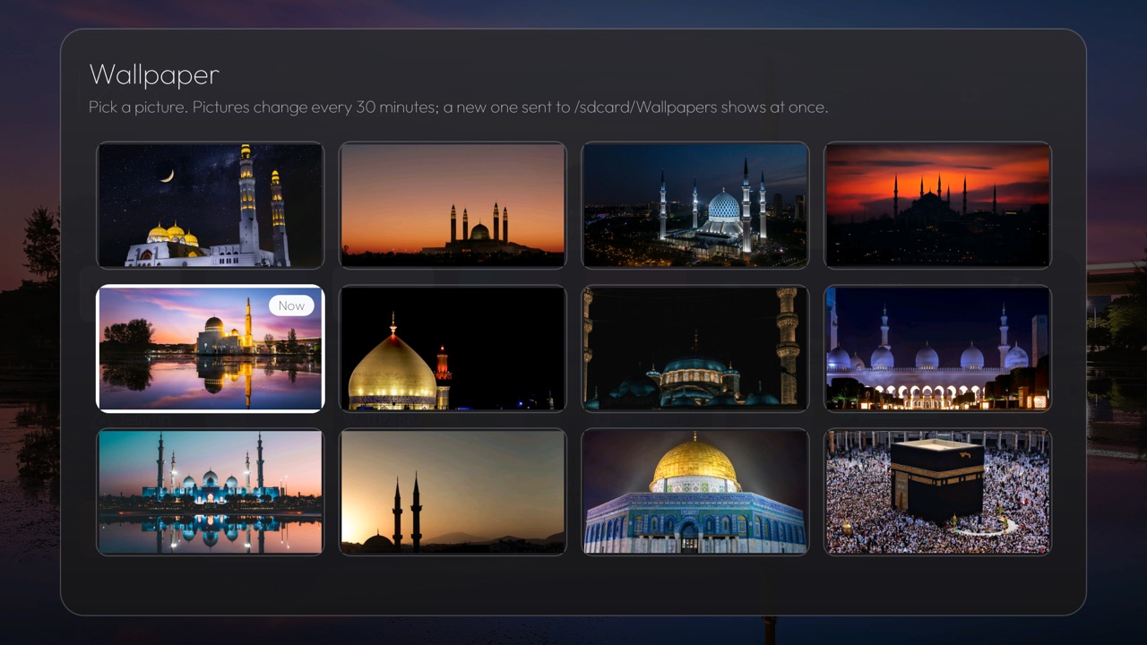 Wallpaper picker with twelve mosque photos, the current one marked Now