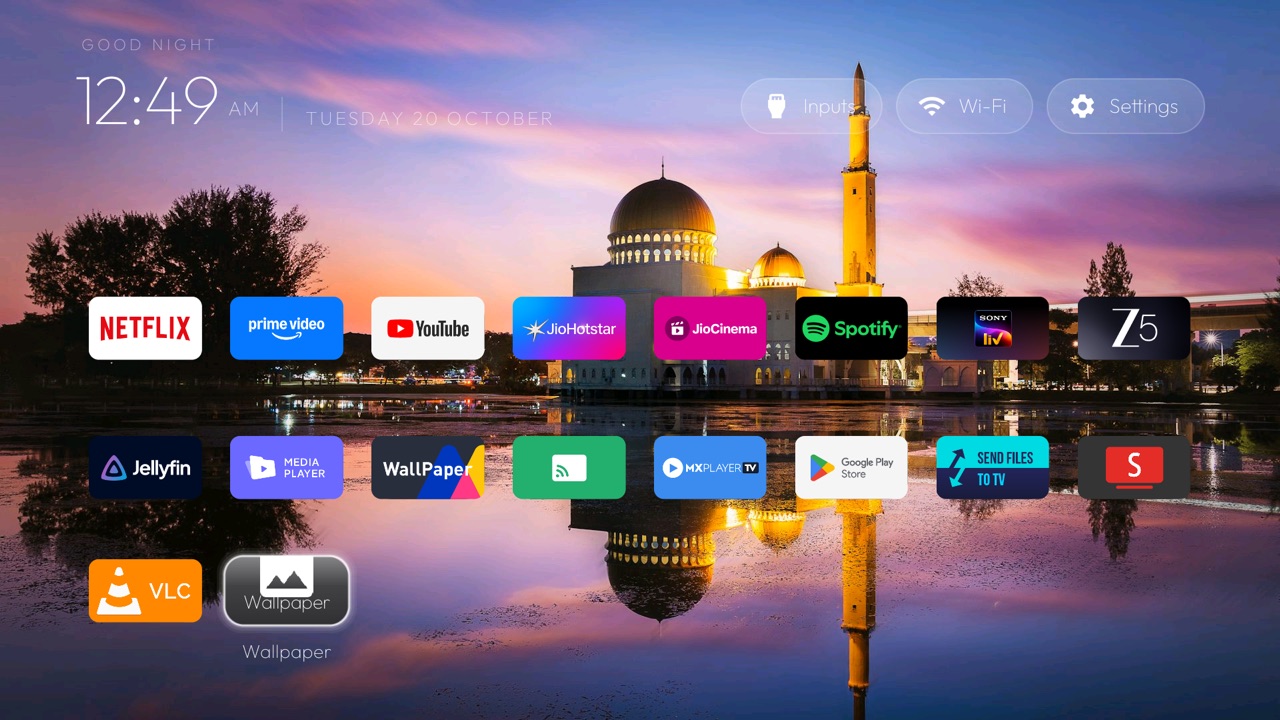 The app grid under the dock with the Wallpaper tile at the end
